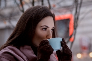 woman drinking tea in cold weather